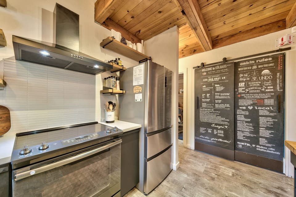 Your fully equipped kitchen features modern appliances and rustic charm, perfect for preparing memorable meals during your mountain getaway.