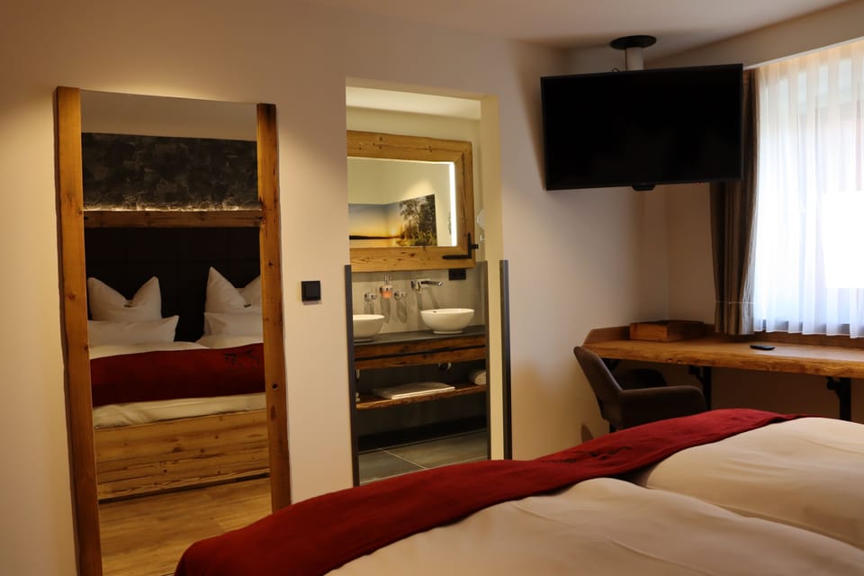 Deluxe Double Room | Living area | Flat-screen TV