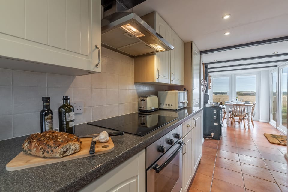 Ground floor: Kitchen looking through to dining conservatory