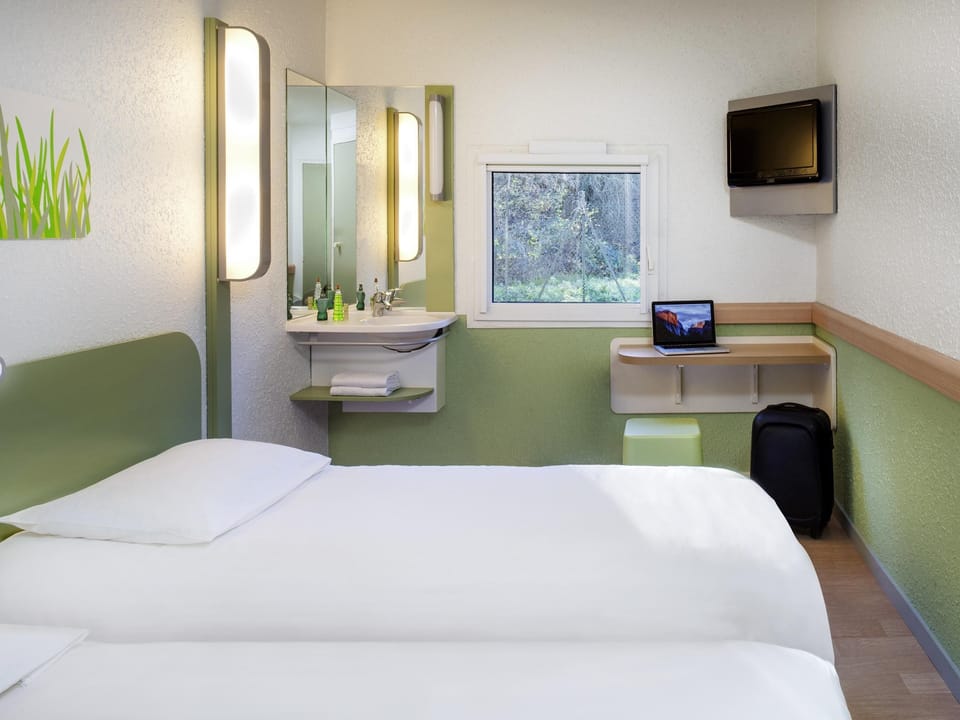 Twin Room, 2 Twin Beds | Desk, blackout drapes, free cribs/infant beds, free WiFi