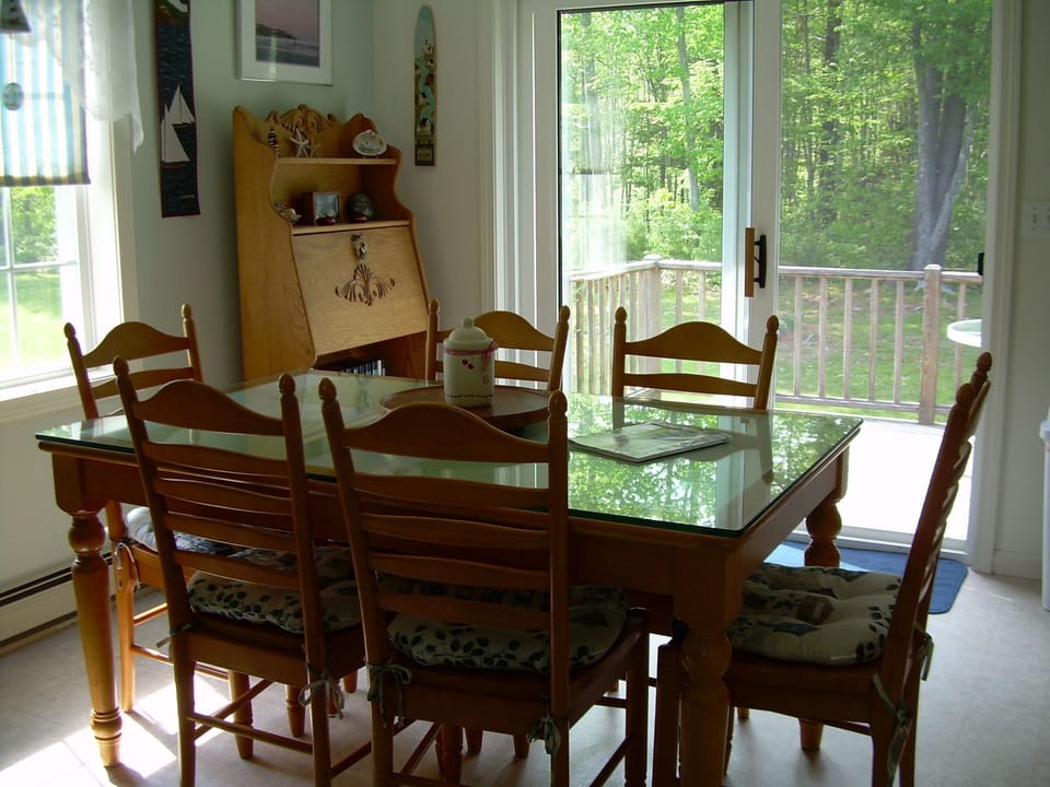 Dining room with sliders to deck