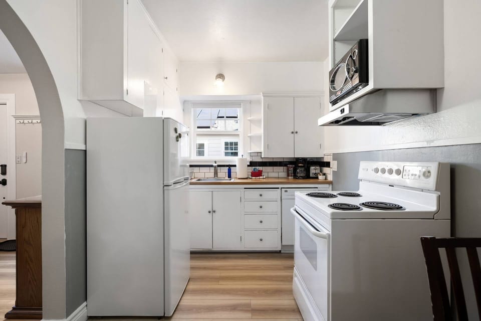 Cook a delicious meal in this charming kitchen.