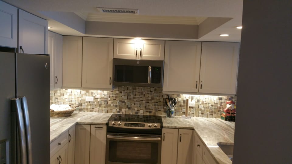 Newly renovated kitchen with stainless steel appliances & granite counter tops.