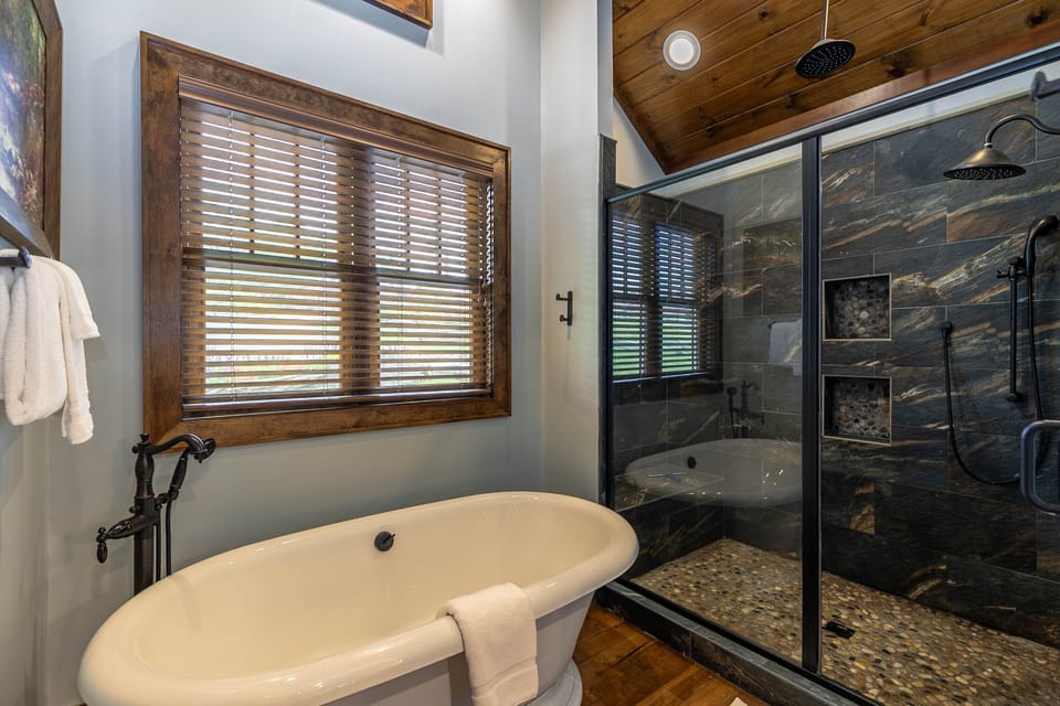 Soak in the freestanding tub or rinse off in the slate-tiled rain shower. Pure relaxation waiting for you at Prancing Horse Lodge At Eagles Nest.