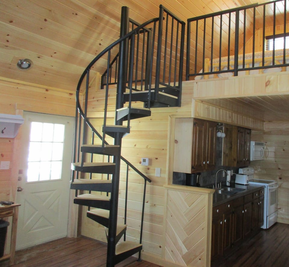 Iron spiral staircase leads to the loft.