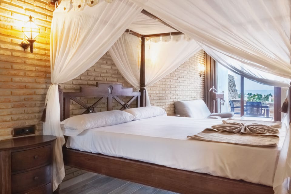 Superior Double Room | Minibar, in-room safe, desk, blackout drapes