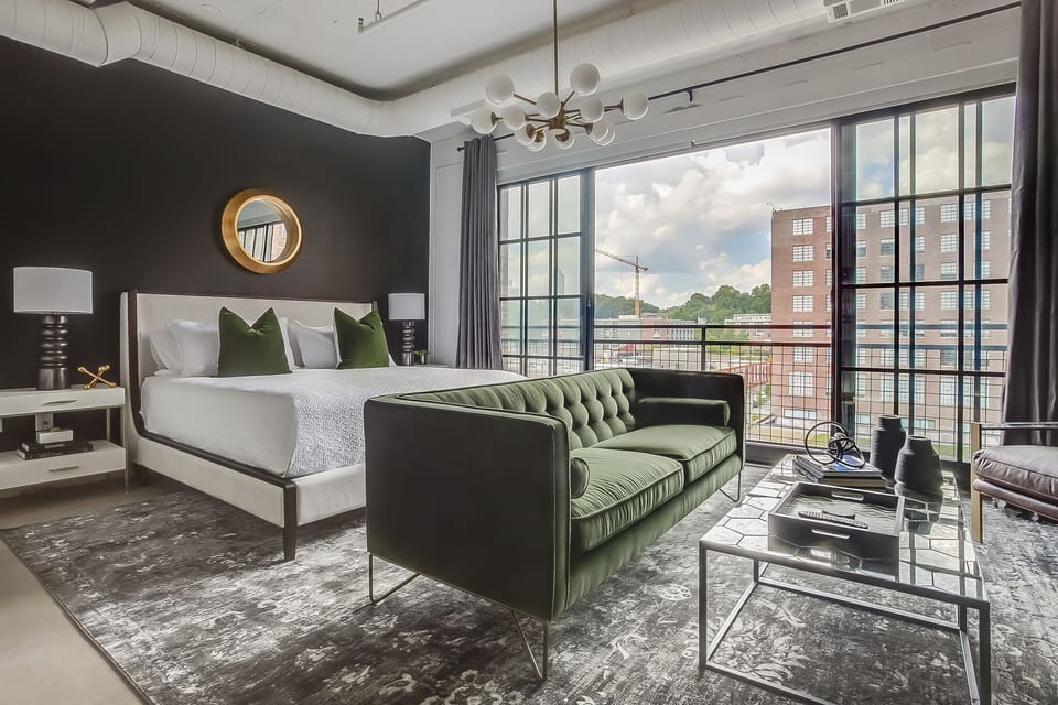 Living/Sleeping area with bed and couch