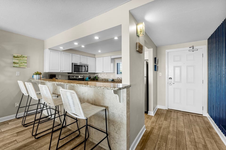 Kitchen With Modern Amenities and Bar Seating