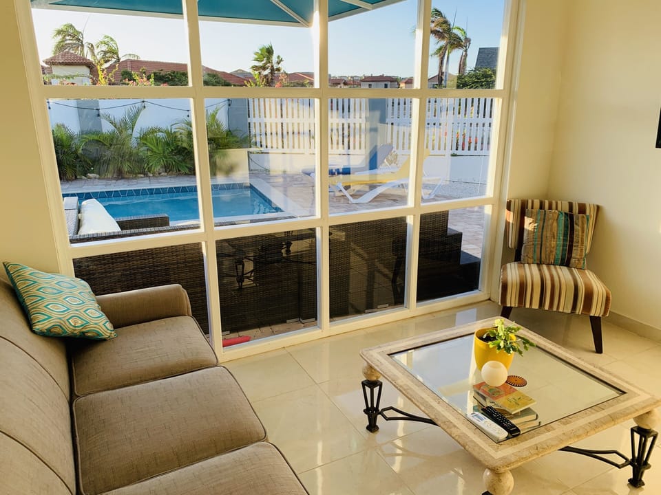 Sitting Area to cool off from the sun with a large 55" Smart TV.