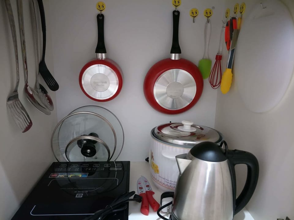 Economy Condo, 1 Bedroom | Private kitchen | Full-size fridge, electric kettle, cookware/dishes/utensils
