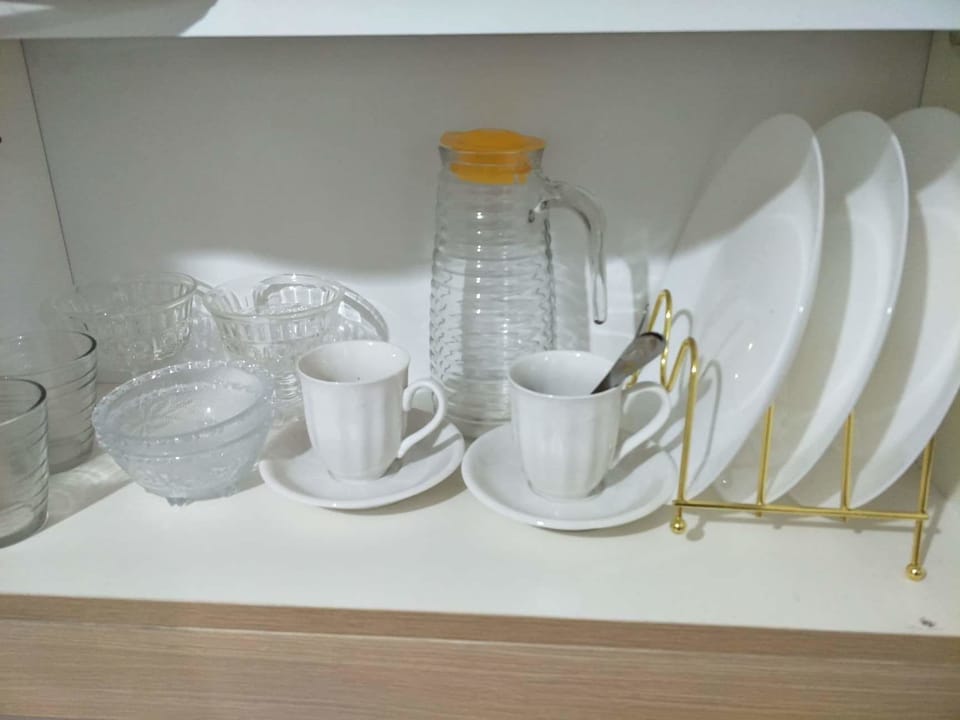 Economy Condo, 1 Bedroom | Private kitchenette | Full-size fridge, electric kettle, cookware/dishes/utensils