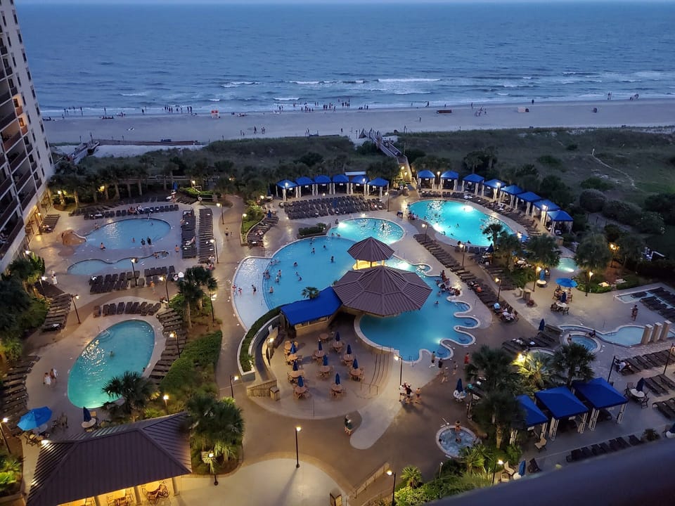 Evening view of pools & beach.  📷 NBP