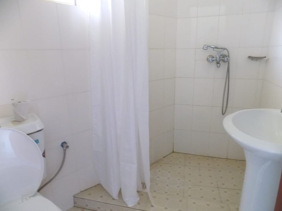 Shower, rainfall showerhead, slippers, towels