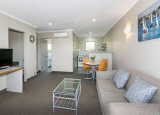 Executive Two Bedroom Suite | Living area | 32-inch LCD TV with satellite channels, TV, iPod dock