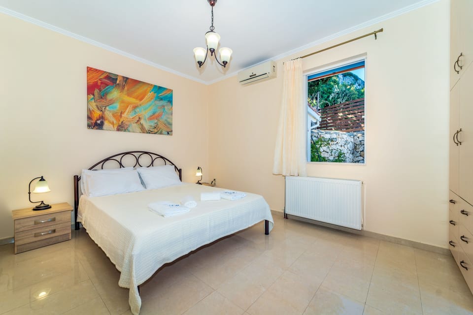 Ground floor double bedroom with en-suite and direct access to the pool area.