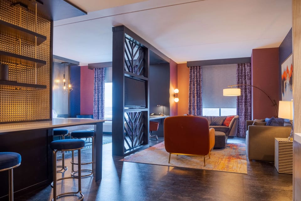 Junior Suite, 1 King Bed | Living area | 51-inch LCD TV with cable channels, TV
