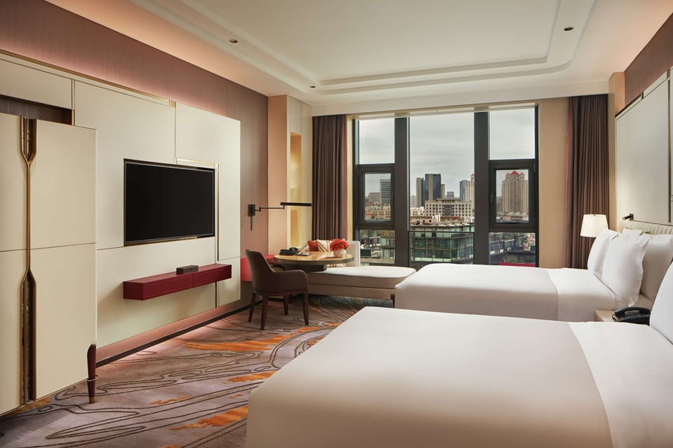 Premium bedding, pillowtop beds, minibar (some free items), in-room safe