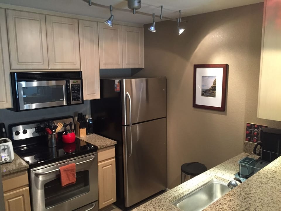 Fully equipped kitchen with all stainless steel appliances and granite counters