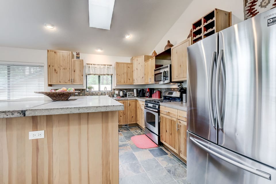 kitchen is all stainless steel appliances.