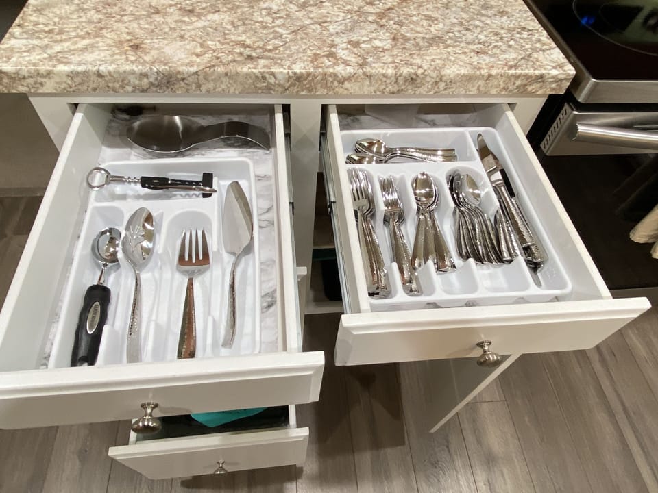 Silverware and dishes that include Serving for 12+