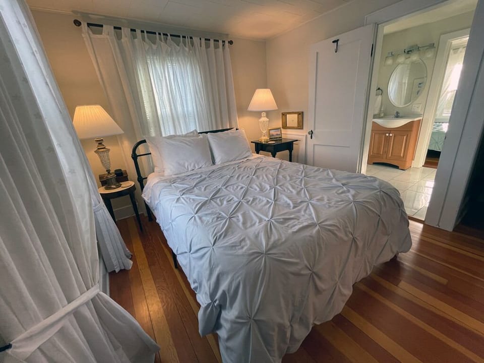 Eagle View with the queen sized bed looking toward the bathroom and The Nest.