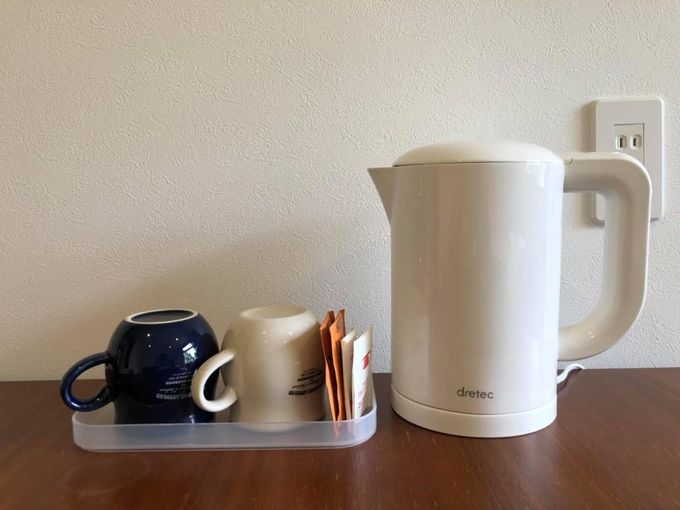 Coffee/tea maker, shared fridge, shared microwave, stovetop