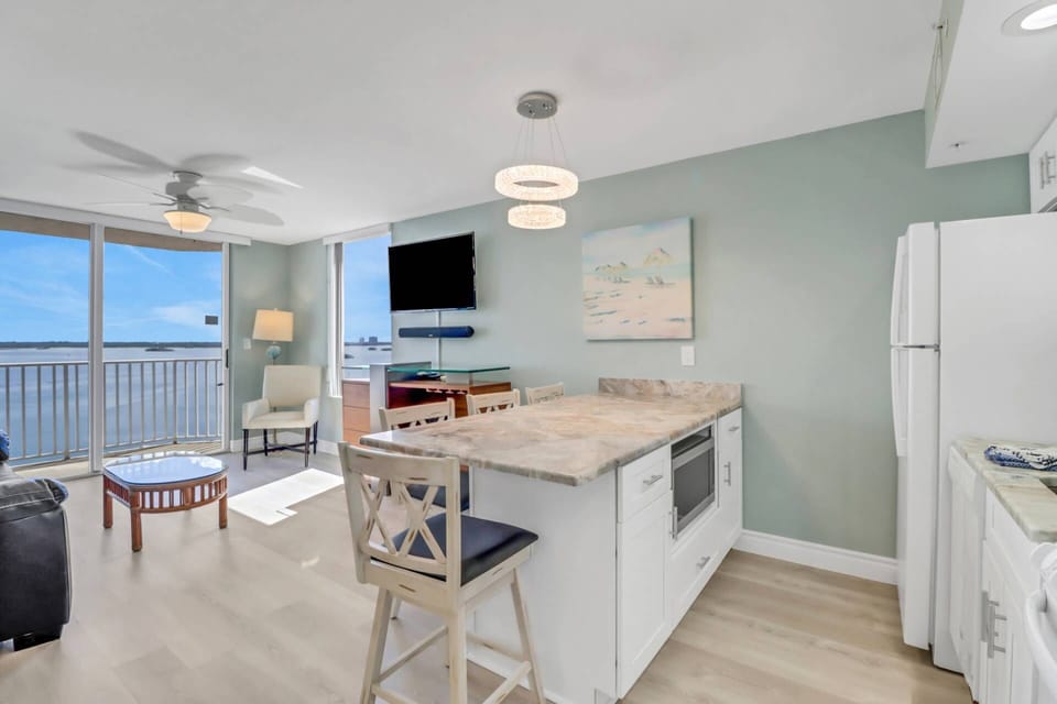 Dining for 4 is easily accommodated at the granite island in the newly remodeled kitchen space.