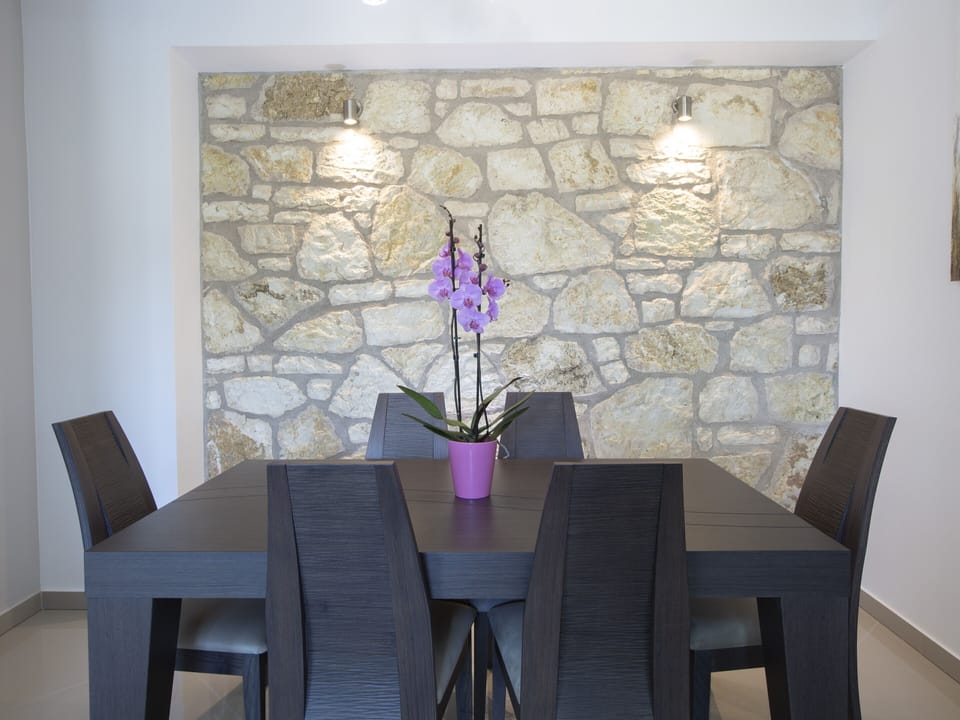 Dining table in the kitchen in new villa Crystal