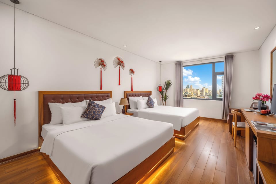 Deluxe Family Room | Minibar, laptop workspace, blackout drapes, soundproofing