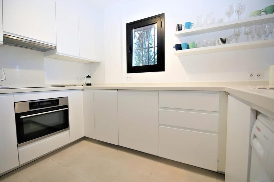 Kitchen with dishwasher, marble worktops, stunning sea views