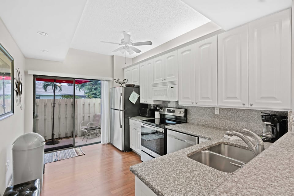 Kitchen equipped with new appliances, marble counter tops, for food preparation