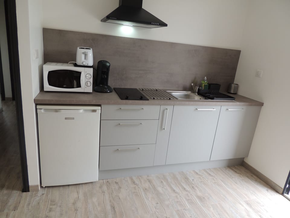 Panoramic Apartment | Private kitchen | Coffee/tea maker, electric kettle