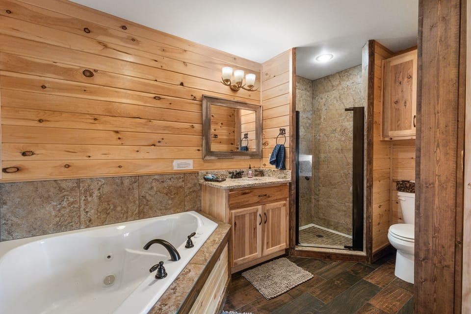 Master bathroom includes tiled walkin shower and 2 person jetted tub