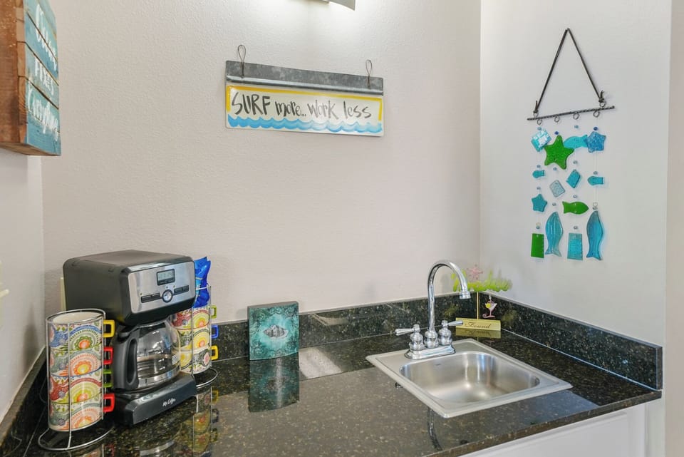 Your compact kitchenette features granite counters, stainless steel sink, and coffee maker for morning brews and light meal prep.