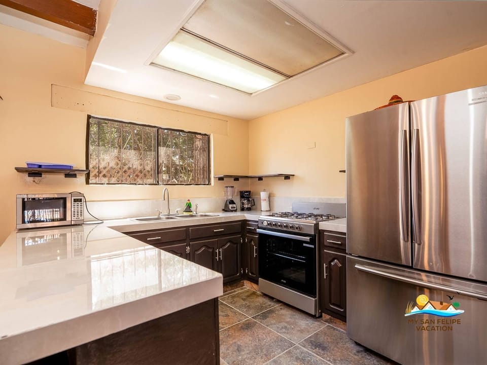 Cook with ease in the modern kitchen at Casa Habana in San Felipe BC MX — stainless steel appliances and plenty of counter space.