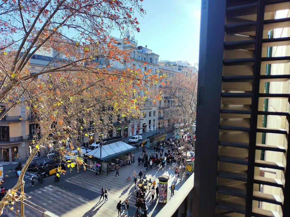 Gaze upon the vibrant energy of Les Rambles from your private French balcony, offering spectacular views of the bustling city life.