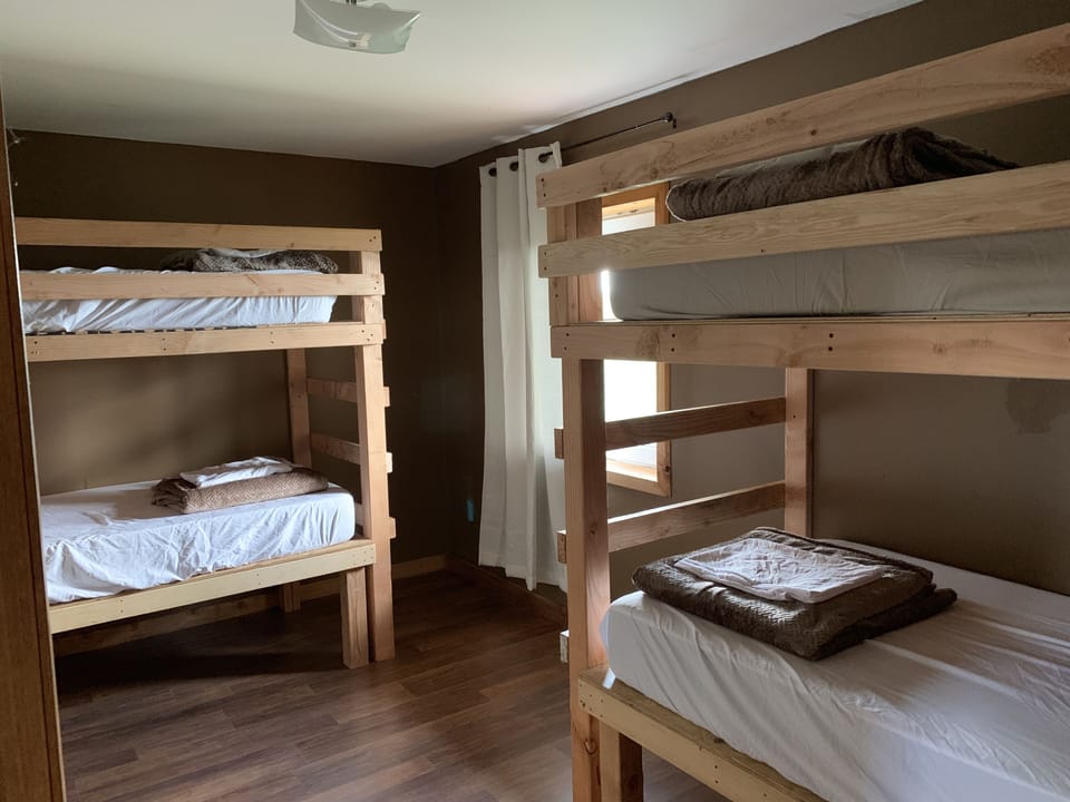 3rd upstairs bedroom with two sets of bunk beds.