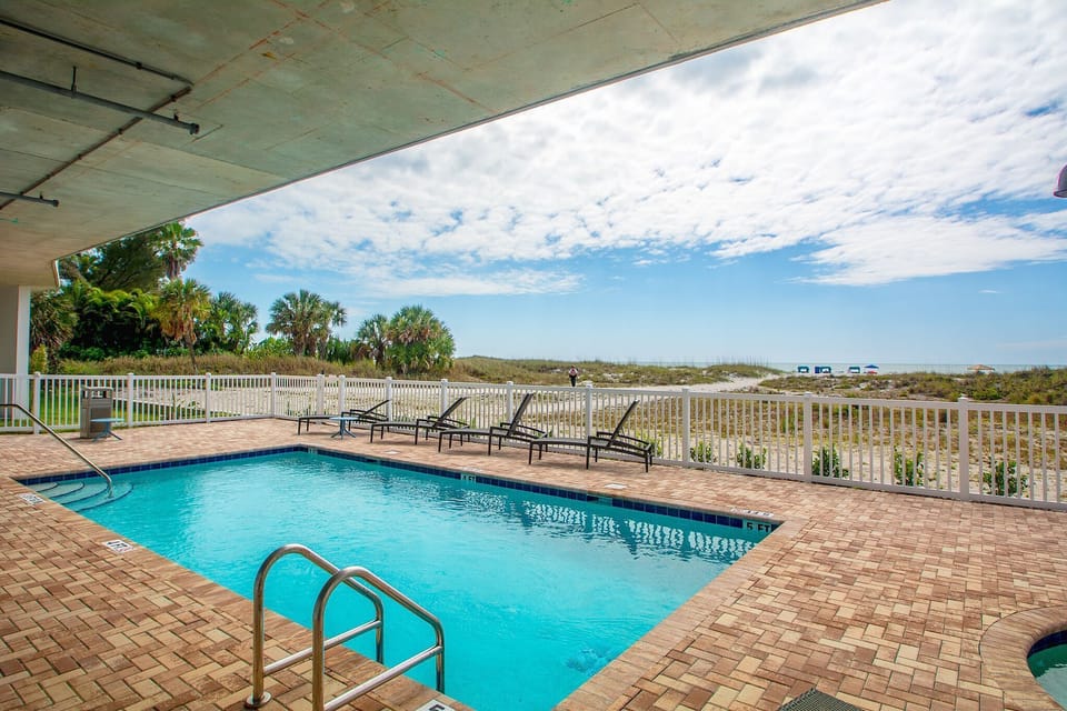 The Pool is Only Steps from the White Sugar Sand Beach
