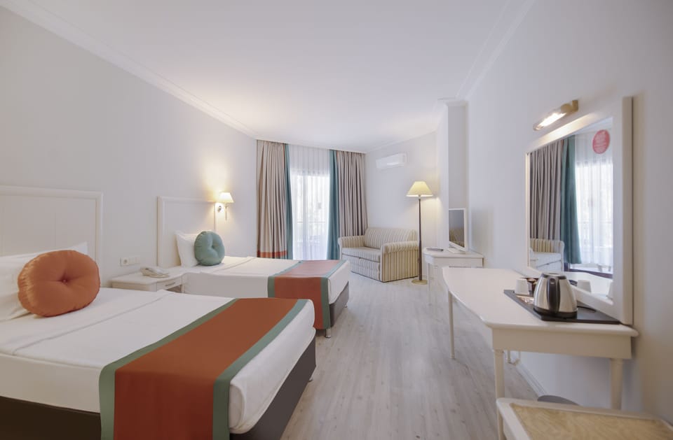 Premium bedding, free minibar, in-room safe, iron/ironing board
