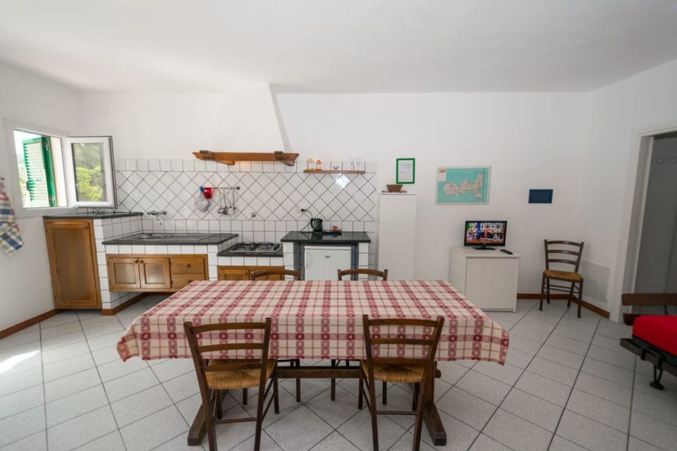 Bilocale Moscato | Living area | Flat-screen TV