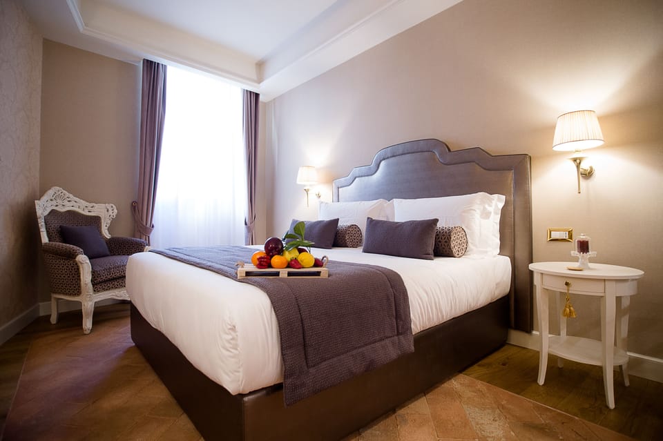 Junior Suite, City View | Minibar, in-room safe, desk, laptop workspace