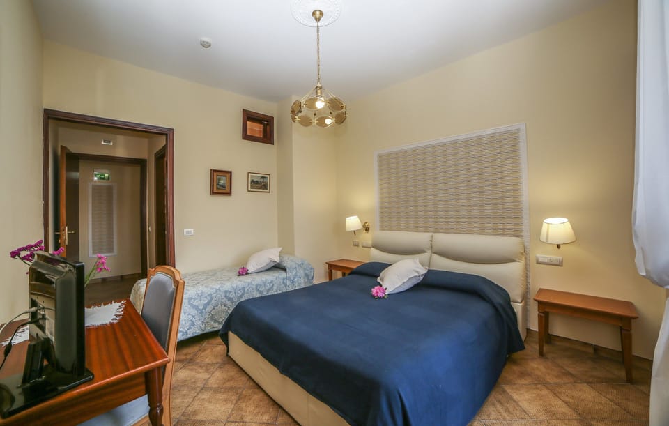 Triple Room, Balcony, City View | Premium bedding, in-room safe, desk, laptop workspace