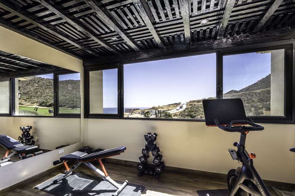 2nd Floor private gym with Peloton, weights, yoga equipment and TRX