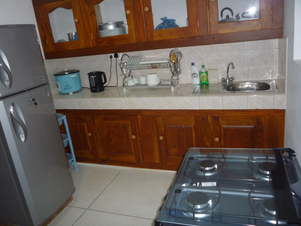 Fridge, rice cooker, cookware/dishes/utensils, dining tables