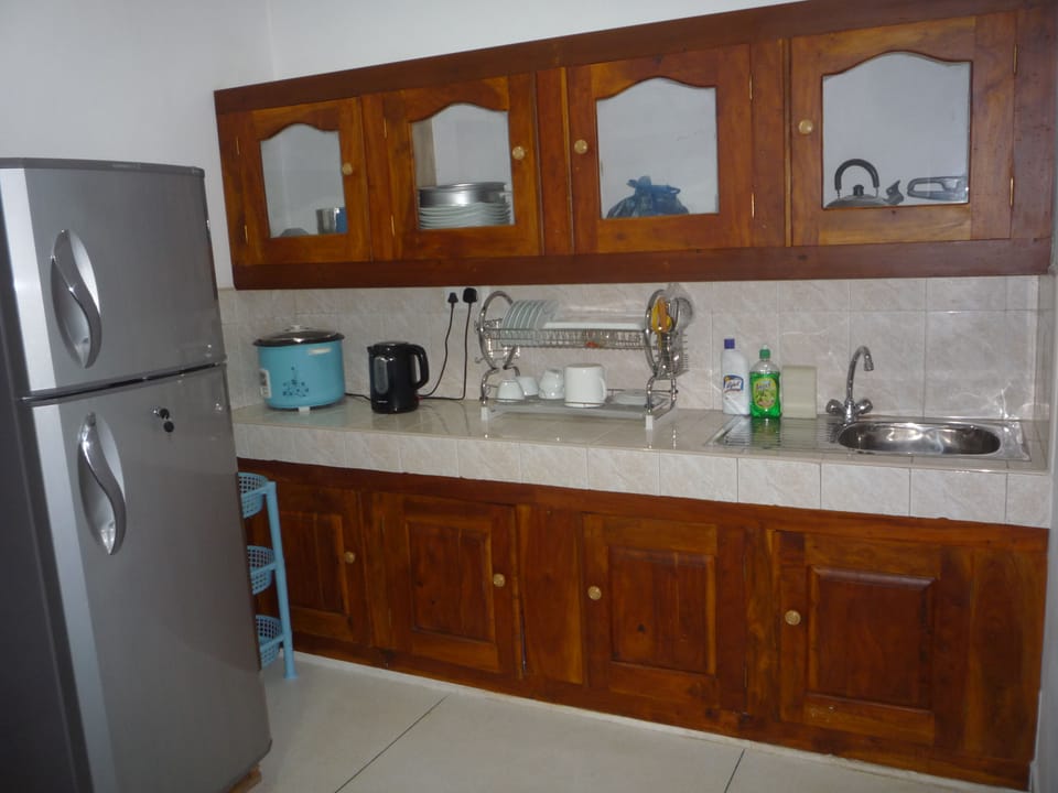 Fridge, rice cooker, cookware/dishes/utensils, dining tables