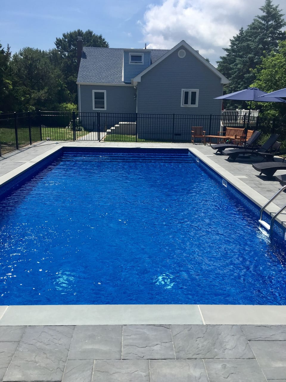 Pool, patio and back of house