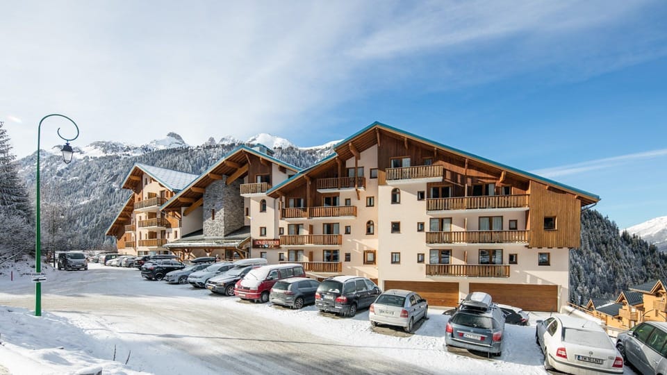 Enjoy a cozy retreat with stunning alpine architecture set against the winter backdrop.