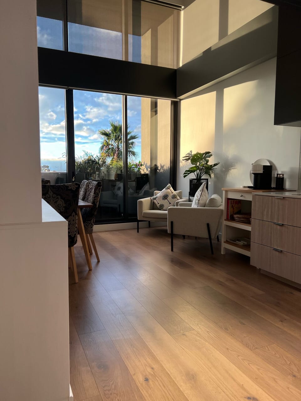 Kitchen/ dining with double height windows 