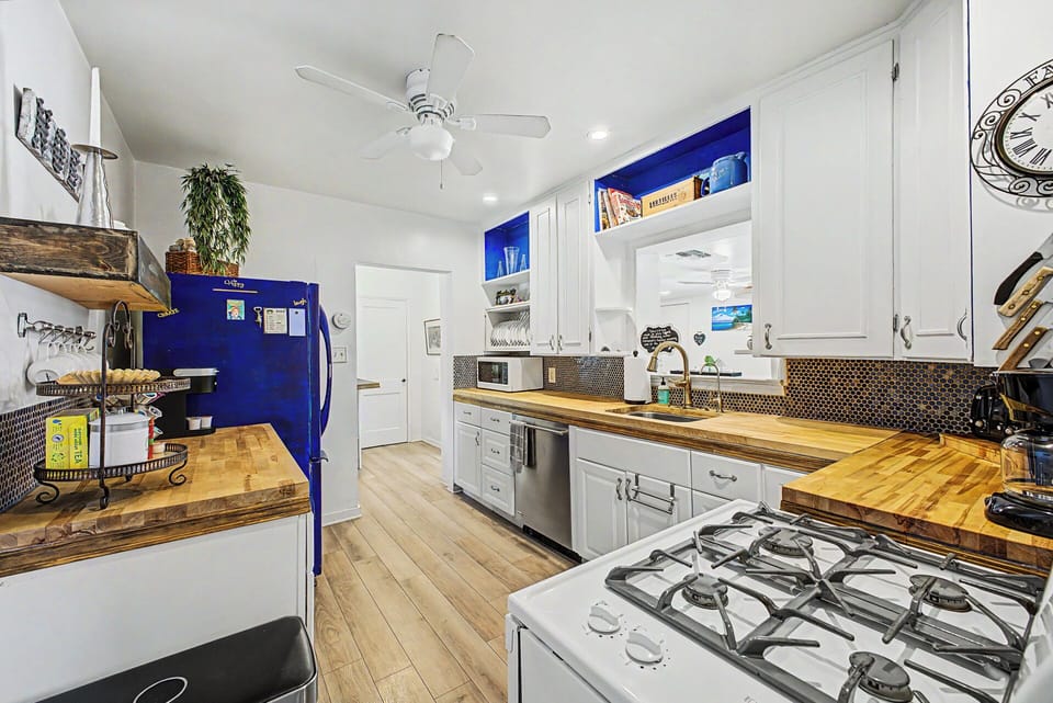 Well-equipped kitchen with gas range and ample counter space