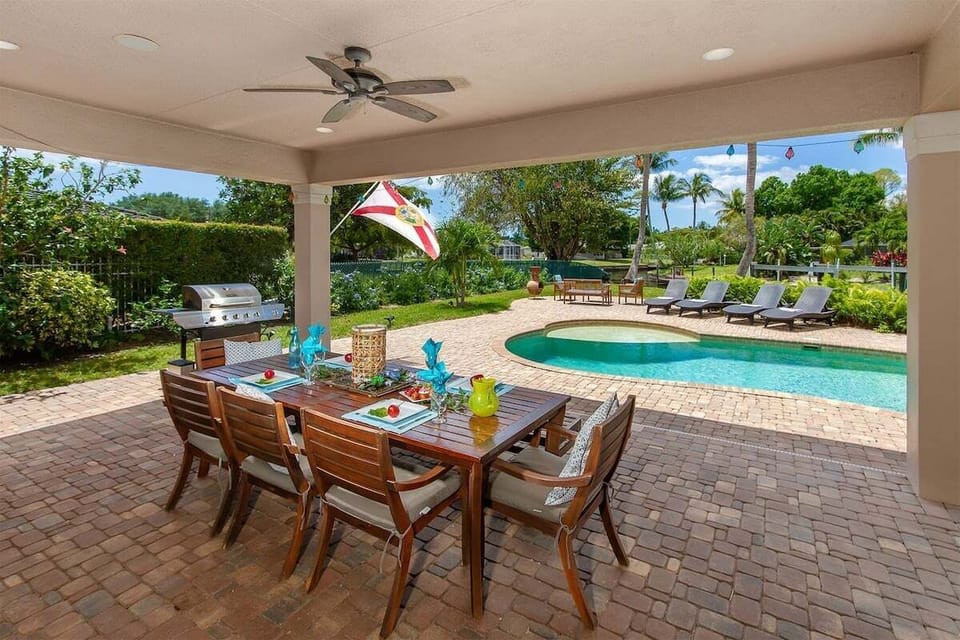 Covered Outdoor Sitting And Dining Area with Room for up to 10 Guests